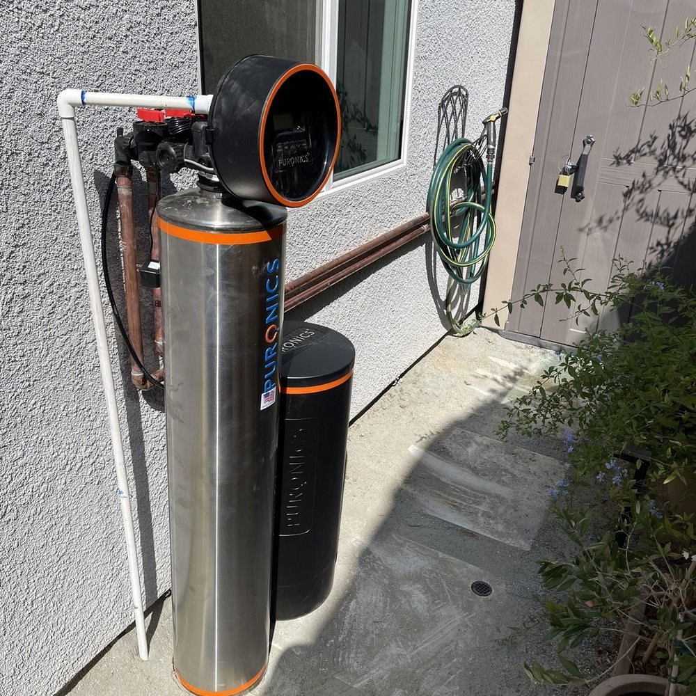 Puronics Terminator system installed on exterior of Houston home